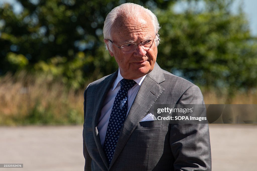 Sweden's King Carl XVI Gustaf arrives at the celebration to...