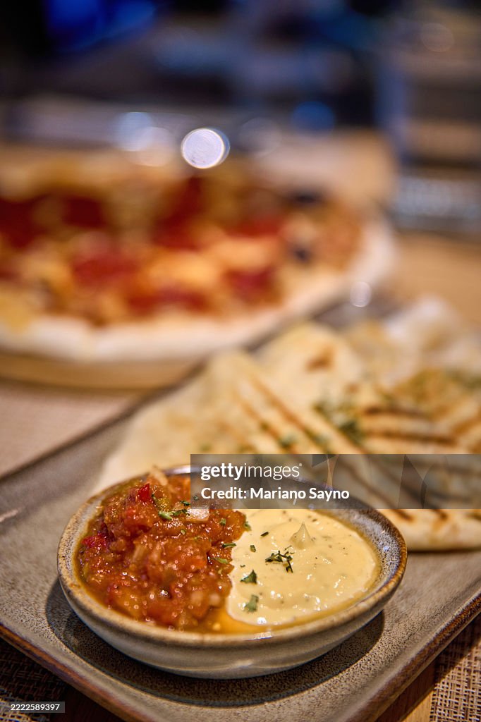 A close-up shows a rectangular plate with two dips.