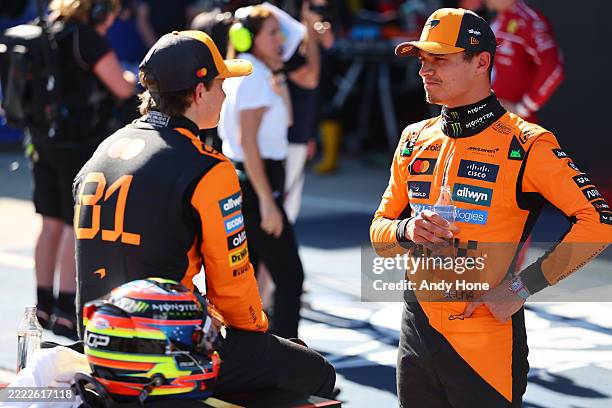 Pole position qualifier Lando Norris of Great Britain and McLaren and Third placed qualifier Oscar Piastri of Australia and McLaren talk in parc...