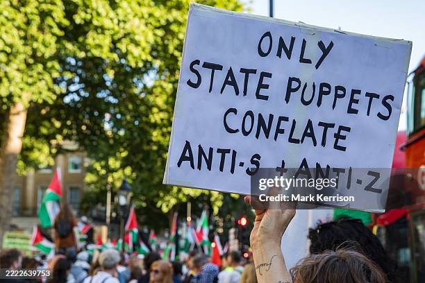 Pro-Palestinian activist holds up a sign at a Defend The Right to Protest rally in defence of Palestine Action outside Downing Street on 2nd July...