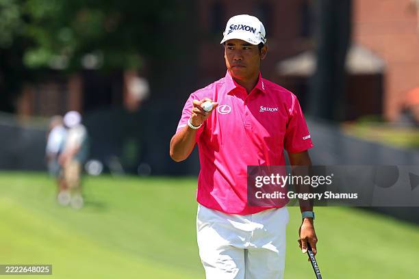 Hideki Matsuyama of Japan acknowledges the crowd on the eighth green during the third round of the Rocket Classic 2025 at Detroit Golf Club on June...