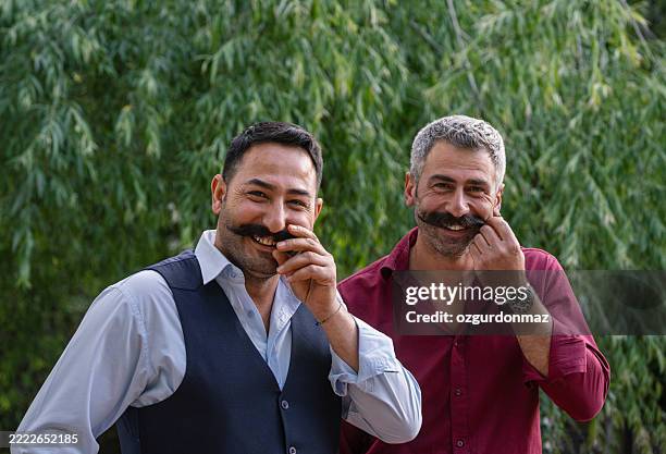 pride and brotherhood - moustache stock pictures, royalty-free photos & images