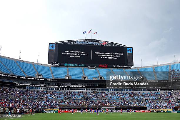 The giant screen informs on weather delay during the FIFA Club World Cup 2025 round of 16 match between SL Benfica and Chelsea FC at Bank of America...