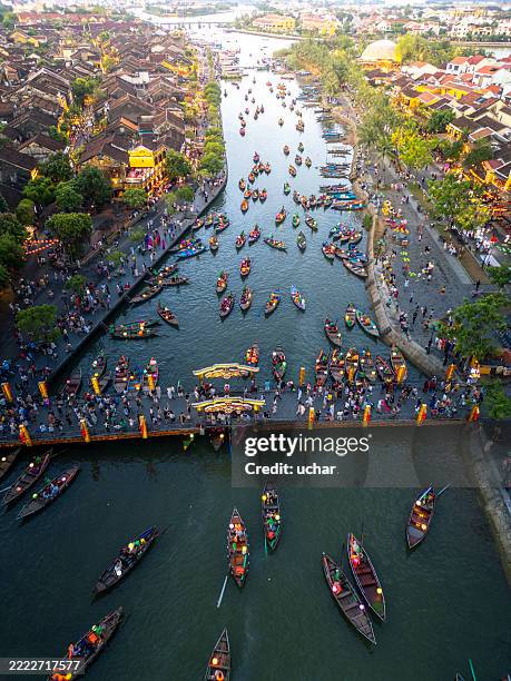 aerial view of lantern boats on the river in hoi an ancient town with drone - hoi an stockfoto's en -beelden
