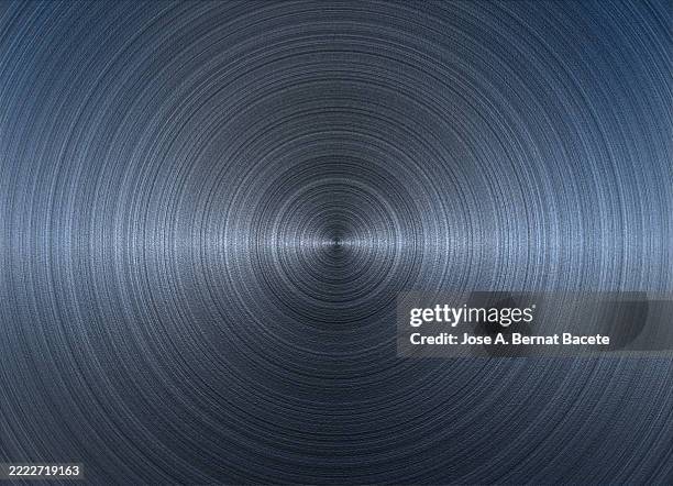 fine texture of a silver metallic sheet with concentric circular grooves. - compact disc fotografías e imágenes de stock