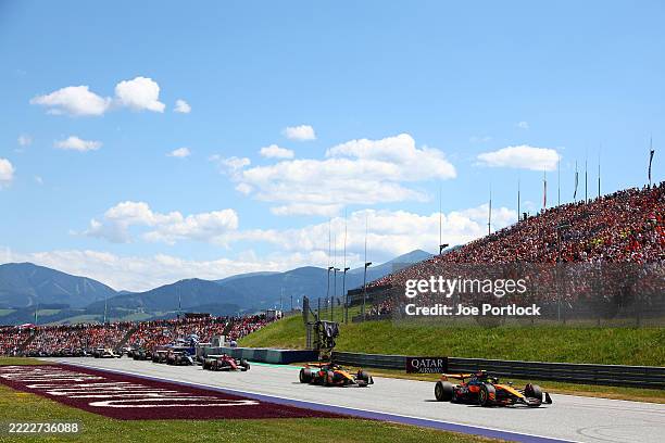 Lando Norris of Great Britain driving the McLaren MCL39 Mercedes leads Oscar Piastri of Australia driving the McLaren MCL39 Mercedes and Charles...