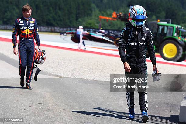 Andrea Kimi Antonelli of Italy and Mercedes AMG Petronas F1 Team and Max Verstappen of the Netherlands and Oracle Red Bull Racing walk away after a...