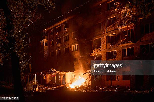 Damaged civilian home burns after being hit by a kamikaze drone after a mass drone and missile attack by the Russian Federation on the capital on...