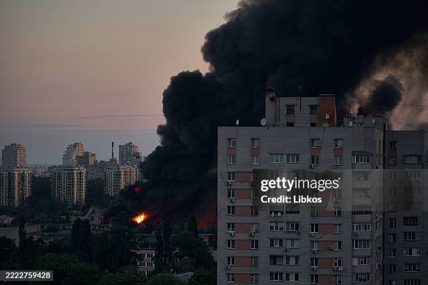 Large plume of smoke rises from a fire after a mass drone and missile attack by the Russian Federation on the capital on Kyiv July 4, 2025 in Kyiv,...