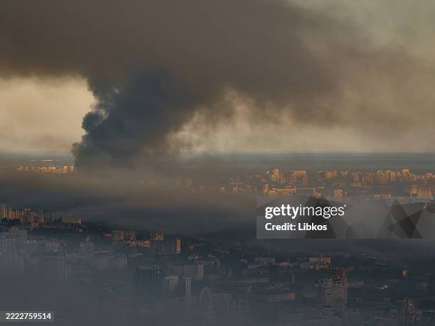Large plume of smoke covers the city after a mass drone and missile attack by the Russian Federation on the capital on Kyiv July 4, 2025 in Kyiv,...