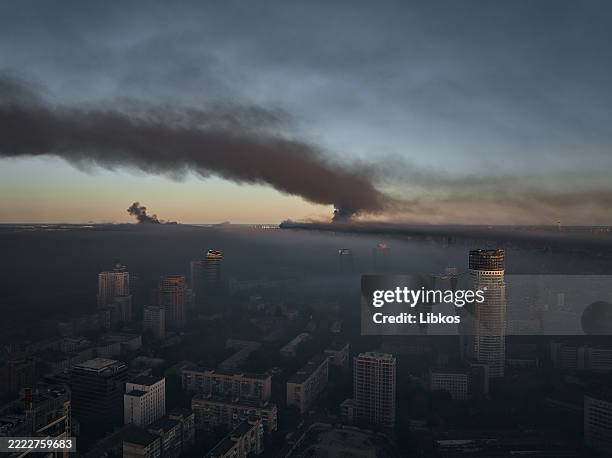 Large plume of smoke covers the city after a mass drone and missile attack by the Russian Federation on the capital on Kyiv July 4, 2025 in Kyiv,...