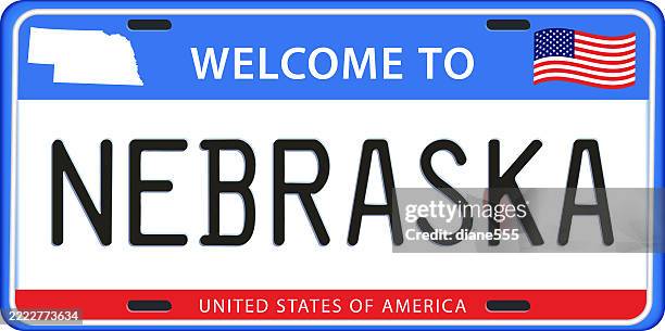 nebraska license plate with state map & flag - nebraska state stock illustrations