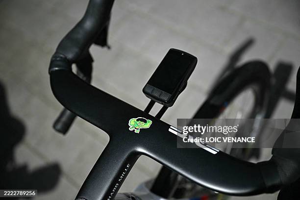 This photograph taken on July 4 shows a close-up detail of UAE Team Emirate - XRG team's Slovenian rider Tadej Pogacar's bicycle handlebars bearing a...