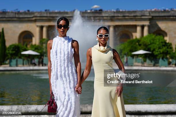 Laura Harrier wears a sleeveless white textured maxi dress with vertical fringe details and a high neckline. Lori Harvey wears a pale yellow...