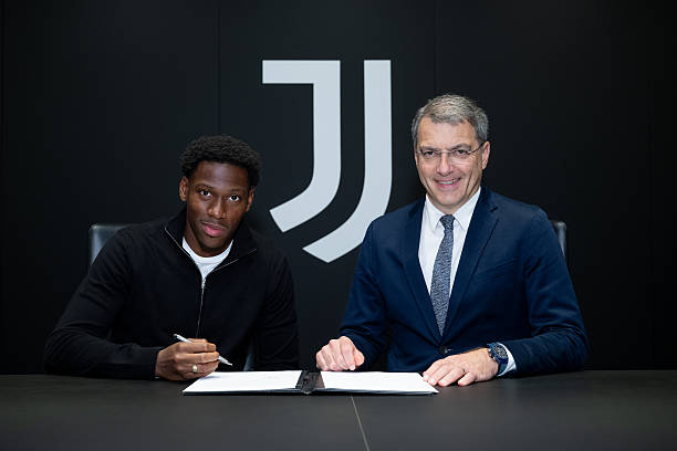 Juventus new signing Jonathan David with Dean Comolli at Juventus headquarters on July 4, 2025 in Turin, Italy.