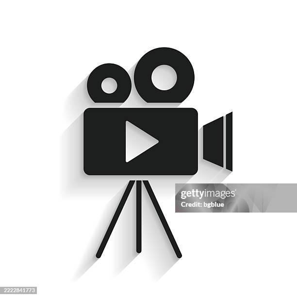 video camera with tripod. icon with long shadow on white background - cinema projector stock illustrations