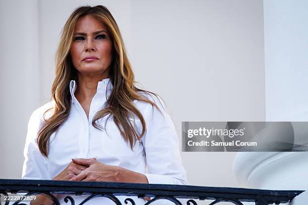 First lady Melania Trump listens as U.S. President Donald Trump delivers remarks during an Independence Day military family picnic on the South Lawn...