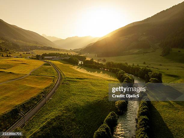 aerial view alpine road through furka pass, switzerland on beautiful dawn - river rhone stock pictures, royalty-free photos & images