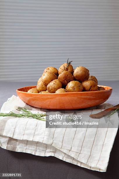 roasted potato herb - oliebollen stockfoto's en -beelden