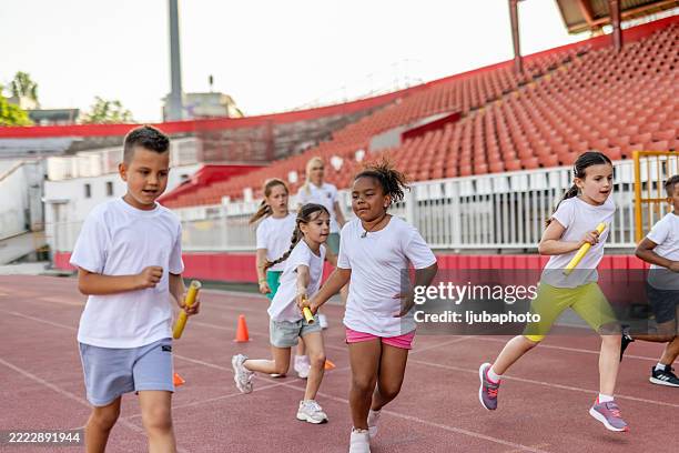 Youth Relay Races 1,248 Relay Race Kid Stock Photos, High-Res Pictures, and Images ...