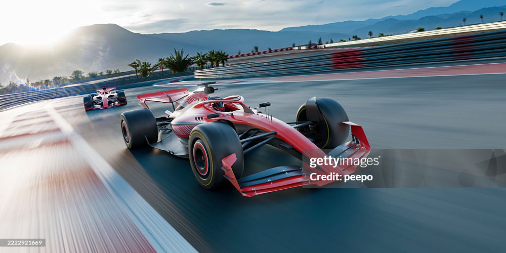 Two Racing Cars Moving At High Speed Along Track