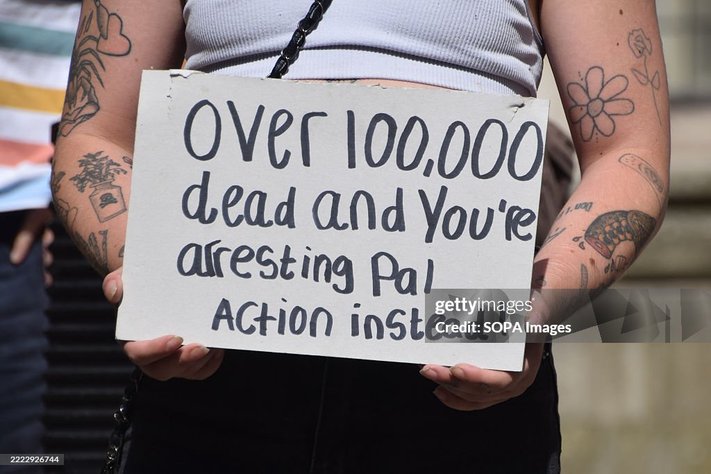 Protestet A protester holds a placard in support of Palestine Action during the ...