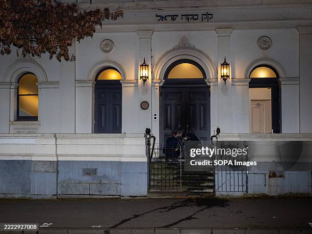 Police officers are seen collecting evidence at the scene of an arson attack at one of Melbourne's oldest synagogues. Police declared a crime scene...