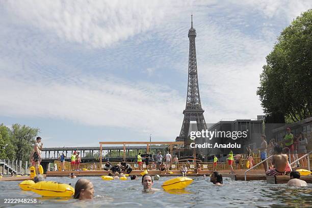 Parisians and visitors return to the Seine to swim officially for the first time after 100 years near the Eiffel Tower in Paris, France on July 5,...