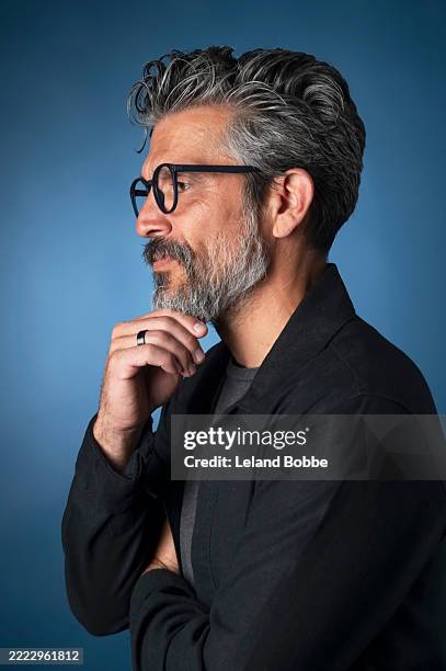 studio portrait of middle age multiracial male - hand on chin stock pictures, royalty-free photos & images