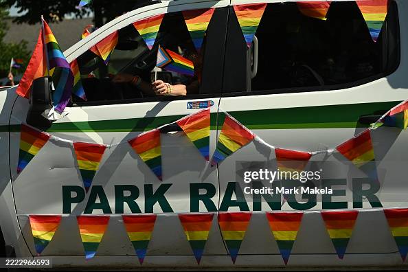 A park ranger waves a gay pride flag during the 2025 Denver Pride ...