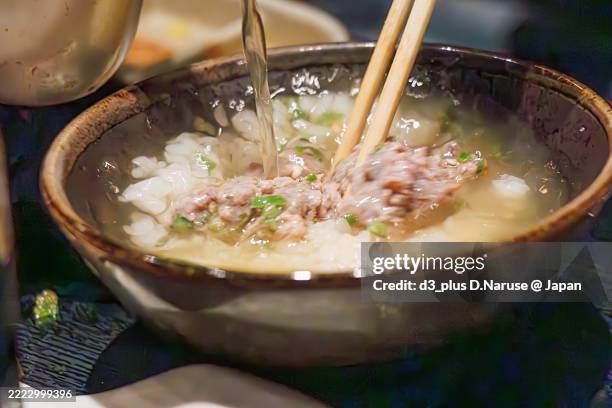 their specialty is a set meal of raw minced “uzuwa”.first, we taste it as sashimi, then put it on rice to make a bowl of rice.the final dish is ochazuke, which is a bowl of rice topped with broth. - izu peninsula stock pictures, royalty-free photos & images