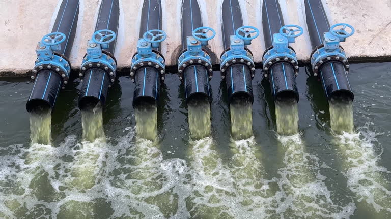 https://media.gettyimages.com/id/2223000000/video/multiple-black-pipes-with-blue-valves-discharging-water-into-a-channel.jpg?b=1&s=640x640&k=20&c=rw6AD1Eaa8VejFp6yEtA5kvSgr3Ir-1t4ouzqUAFPr4=