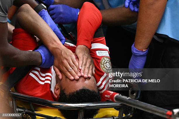 Bayern Munich's German midfielder Jamal Musiala leaves the pitch during the FIFA Club World Cup 2025 quarterfinal football match between France's...