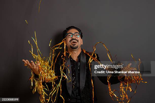 joyful celebration with colorful party streamers - happy new year celebration in india stock pictures, royalty-free photos & images