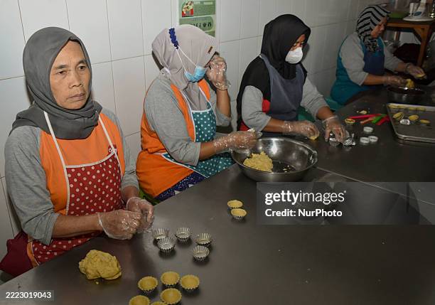 Workers make ape-flavored pie at a small and medium-sized enterprise in Bumiaji Village, Batu City, East Java, Indonesia, on July 5, 2025.