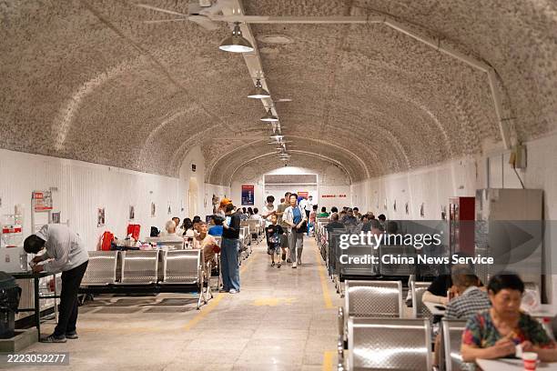 Citizens escape summer heat at a public air-raid shelter on July 1, 2025 in Hangzhou, Zhejiang Province of China. With scorching heat waves sweeping...
