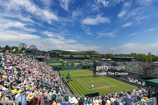 General panoramic view of Wimbledon packed with spectators, with a back-drop of Centre Court, as Clara Tauson of Denmark plays against Heather Watson...