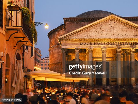 People dining outside in Piazza della Rotonda in Rome at dusk People dining outside in Piazza della Rotonda in Rome at dusk