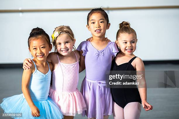 elementary aged children practicing ballet combo class in a dance studio - funny ballet stock pictures, royalty-free photos & images