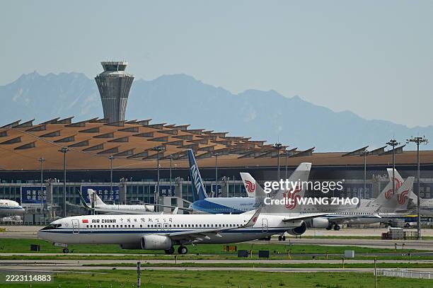 An Air China Boeing 737-800 plane waits to take off at Beijing International airport on July 6, 2025.
