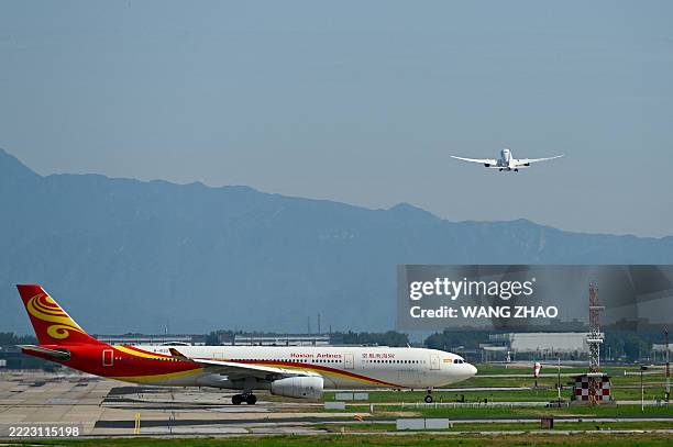 An Air China Airbus 330-300 plane waits to take off at Beijing International airport on July 6, 2025.