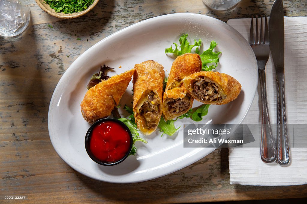 Overhead angle of fried cheesesteak egg rolls
