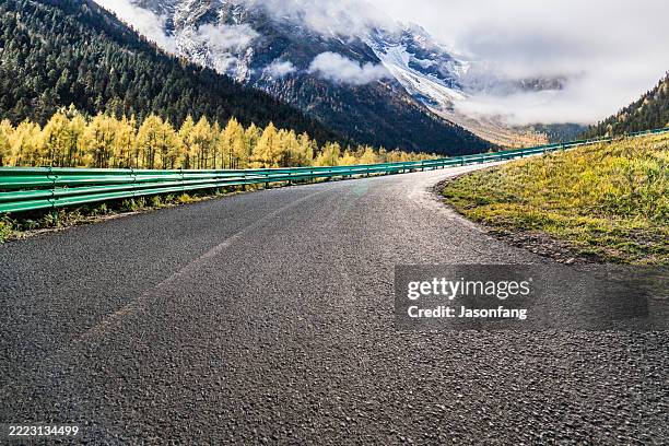 mountain road - empty road stock pictures, royalty-free photos & images