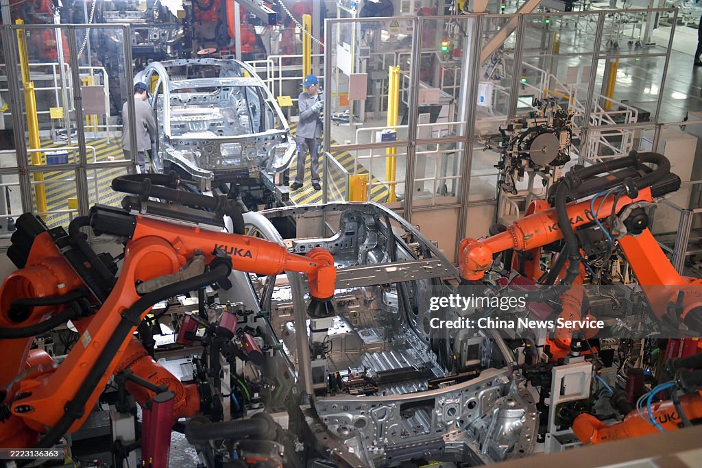 Robotic hands work on a new energy vehicle production line of NIO