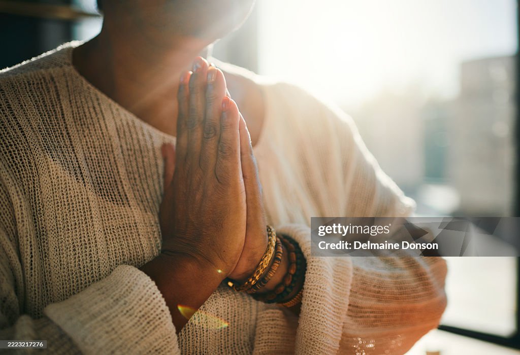 Peaceful Moment of Prayer in Sunlight
