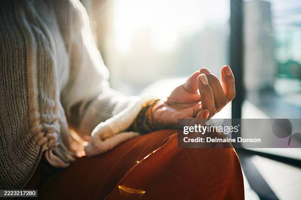 serene meditation in morning sunlight - meditation stock pictures, royalty-free photos & images