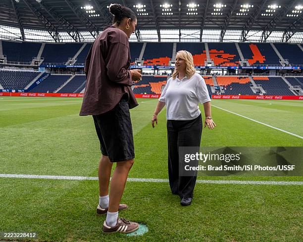 Emma Hayes of the United States talks with Lauren Betts of UCLA before a game between Ireland and the USWNT at TQL Stadium on June 29, 2025 in...