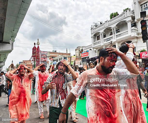 Shia Muslim devotees take out a religious procession on the occasion of Muharram to mourn the martyrdom of Hussain, the grandson of Prophet Mohammad,...