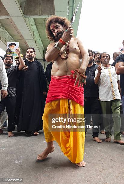 Dr. Sarang Mohiley and other Muslim devotees take out a religious procession on the occasion of Muharram to mourn the martyrdom of Hussain, the...