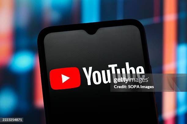 In this photo illustration, the YouTube logo is seen displayed on a smartphone screen.